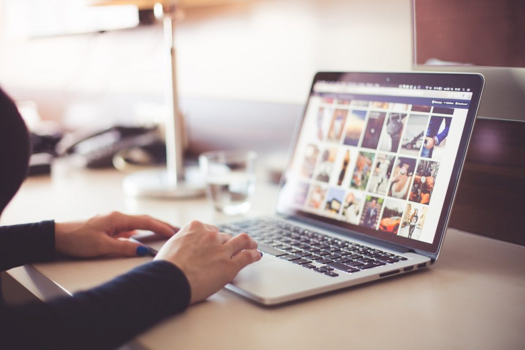 Woman on computer looking at images for seo mistakes