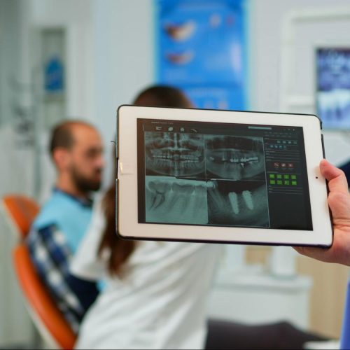 Dental practice's success story shared on Facebook through authentic patient testimonials and impactful before/after images.
