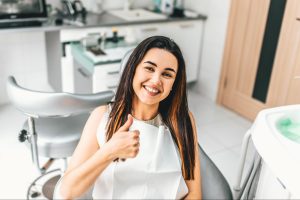Dental practice's success story shared on Facebook through authentic patient testimonials and impactful before/after images.