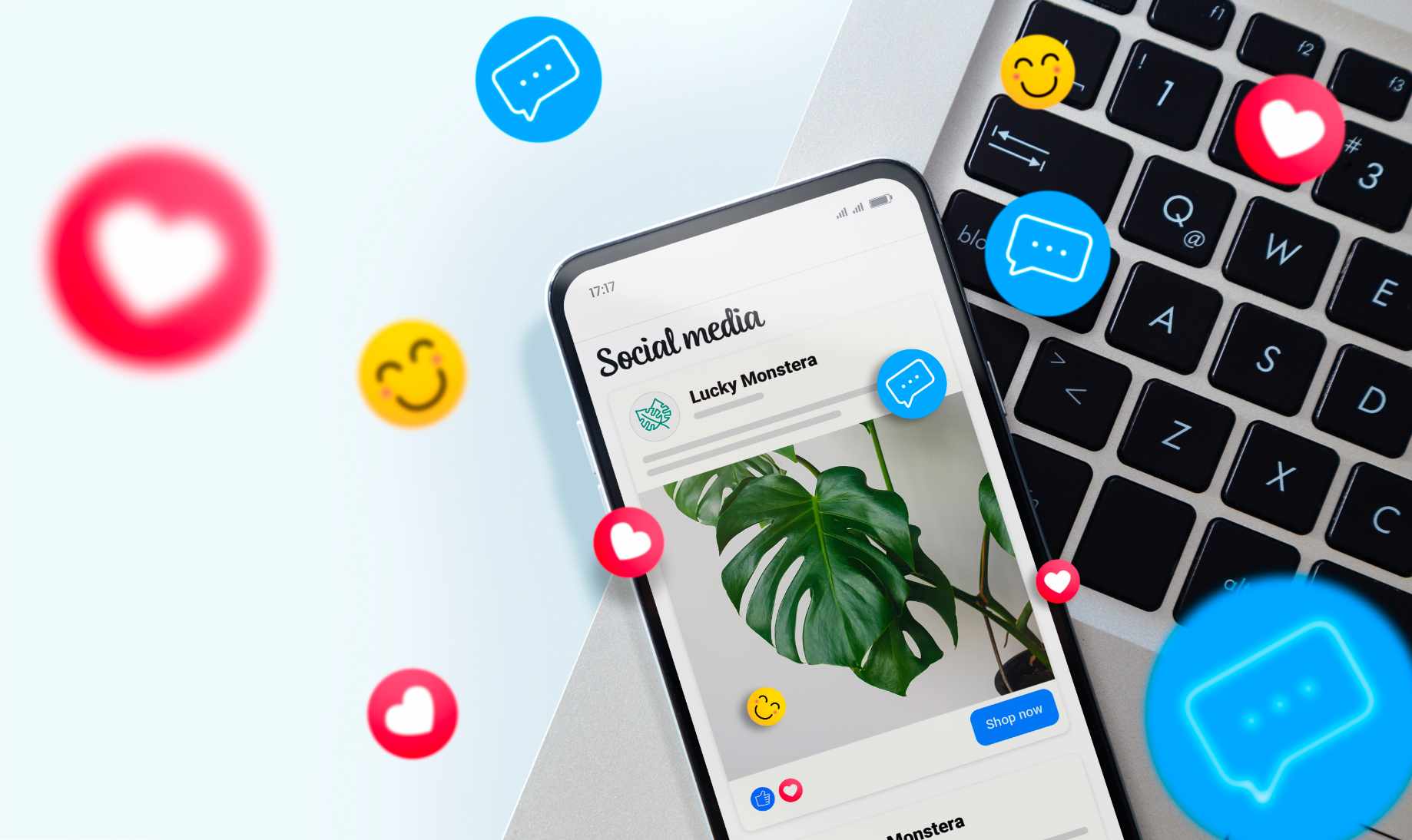 Smartphone displaying social media post with a Monstera plant image beside a keyboard. Floating emojis convey a lively, engaging social media vibe.